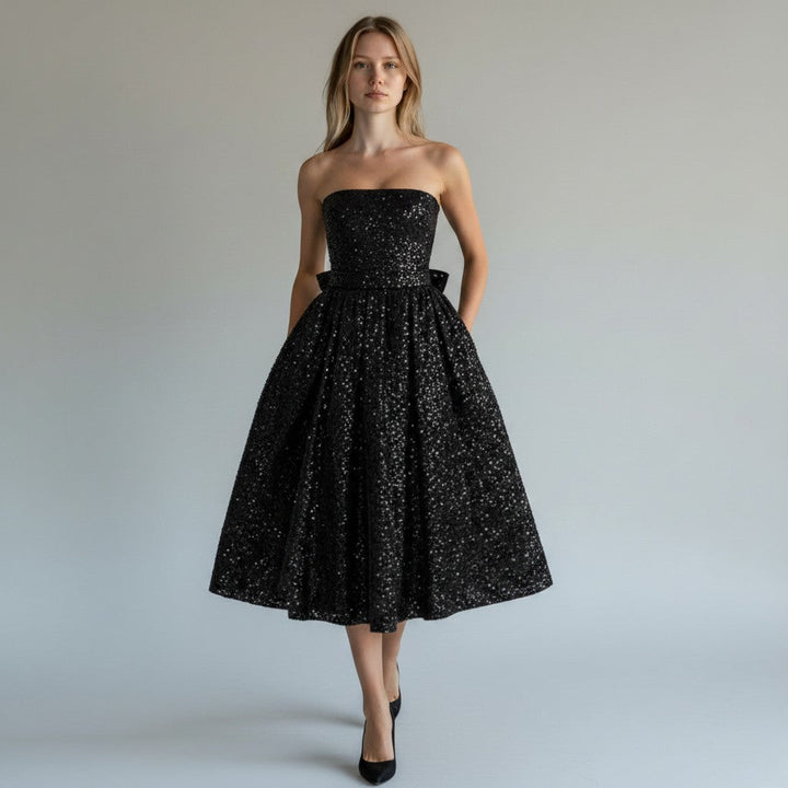 Sophisticated women's sequin midi dress in a flowing, sleeveless design. Perfect elegant party & occasion wear.