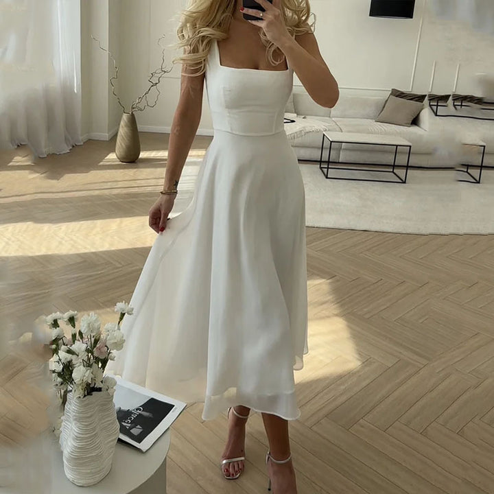 Elegant women's sleeveless square neck midi dress, perfect for formal events or parties. Chic and timeless design.