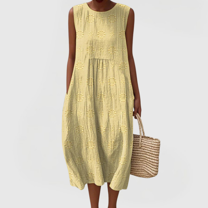 Chic sleeveless women's dress with a flowy fit, elegant design & hidden pockets, suitable for summer occasions.