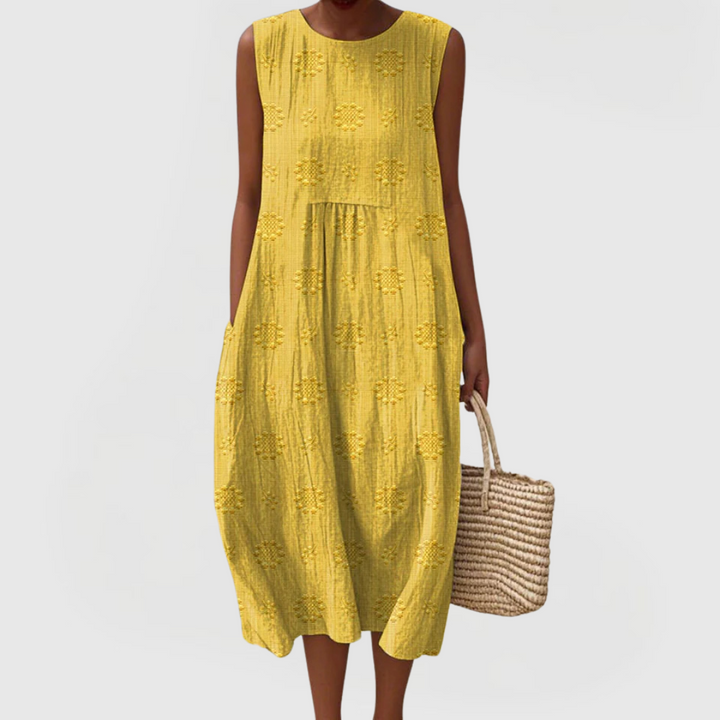 Versatile women's sleeveless dress with practical pockets and elegant design, ideal for casual or vacation wear.