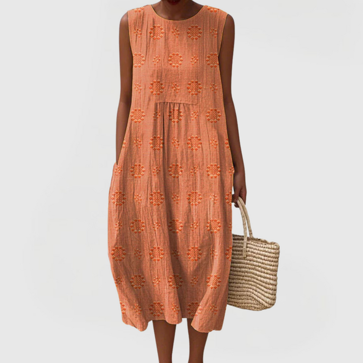 Graceful women's sleeveless summer dress featuring beautiful floral embroidery and functional side pockets.