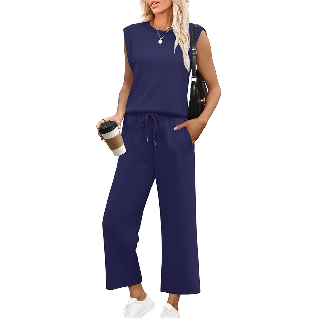 Women's two-piece set: comfortable sleeveless top with flowy wide-leg trousers. Versatile summer fashion.