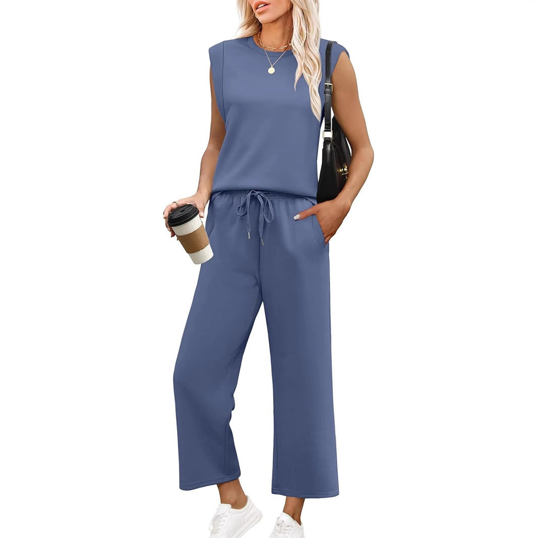 Flowy women's sleeveless top and wide-leg trousers set, offering comfortable, elegant summer style.