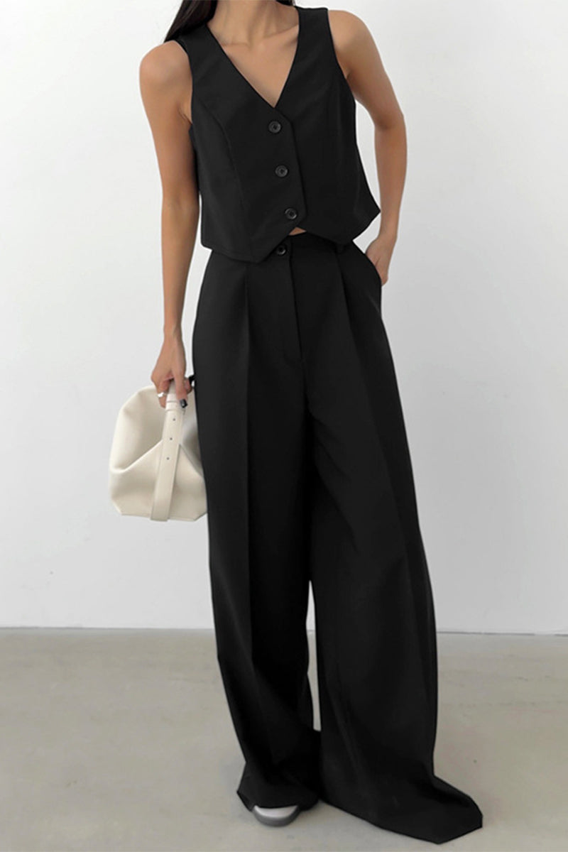 Sophisticated women's workwear set with a sleek sleeveless waistcoat and flowing wide-leg trousers.