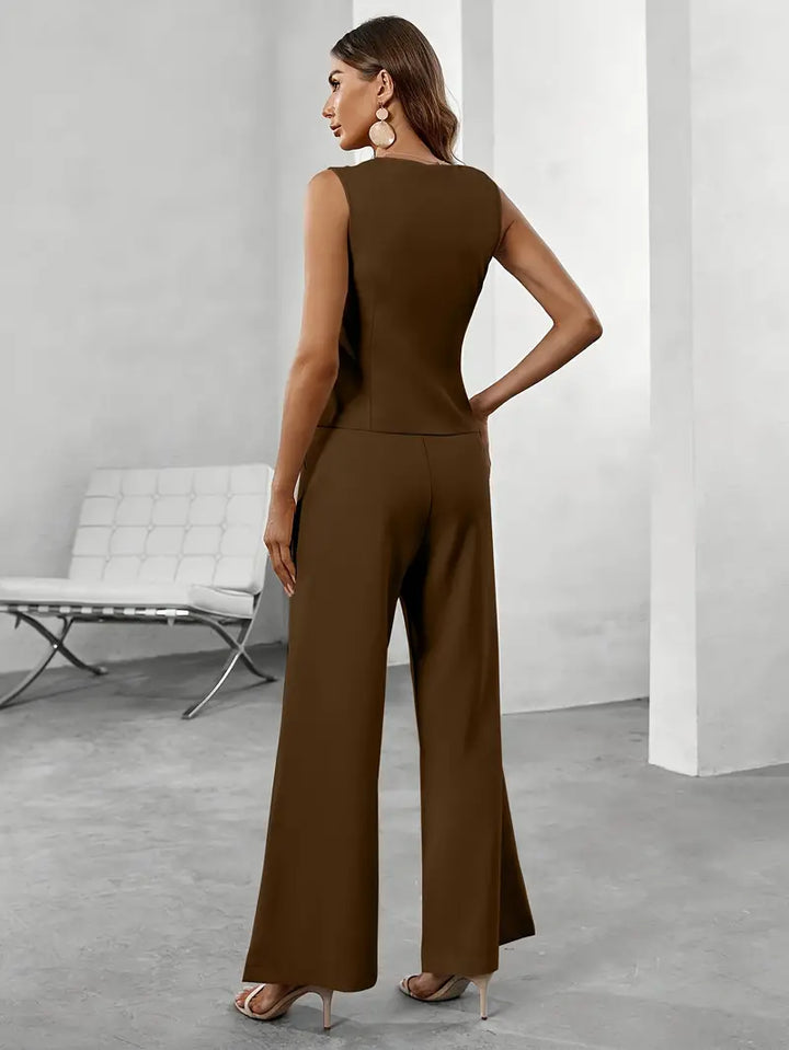 Stylish women's sleeveless wide leg suit, featuring a button-up top. Elegant two-piece set for business & professional wear.