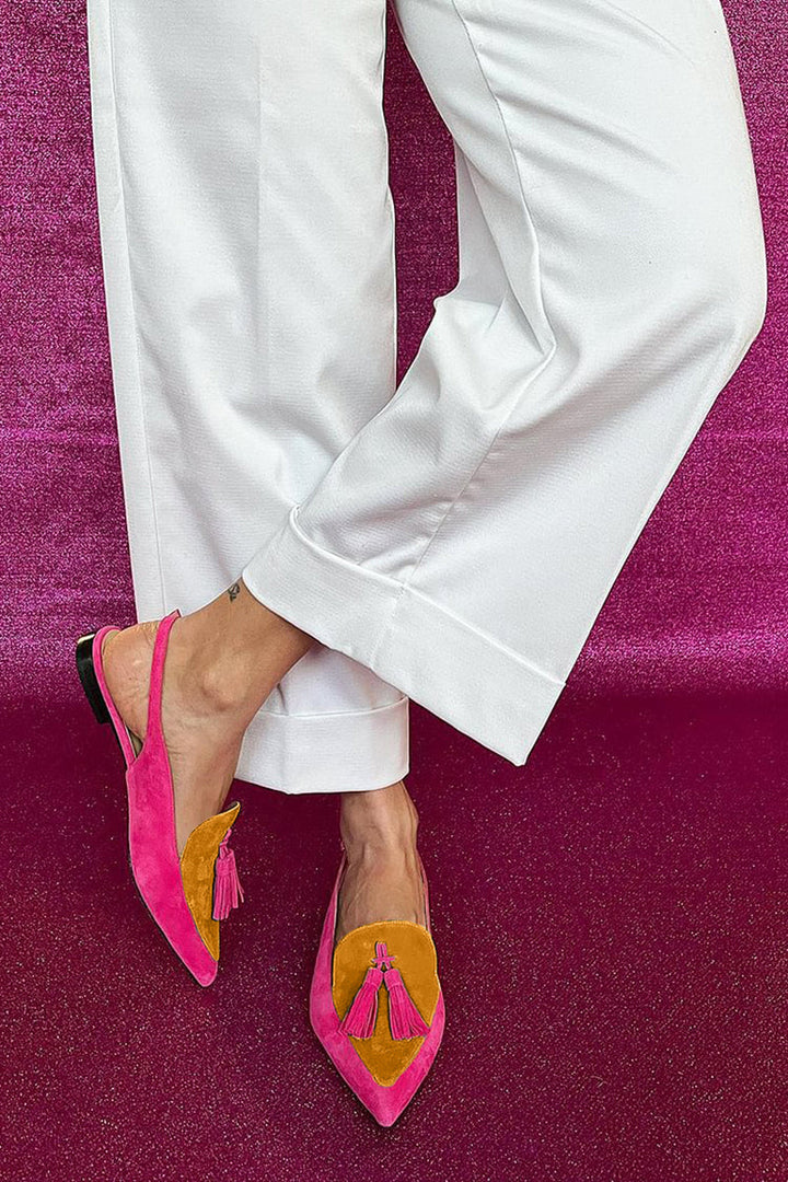 Women's fashion loafers: elegant pointed toe slingbacks featuring stylish tassel detail. Perfect casual or smart footwear.