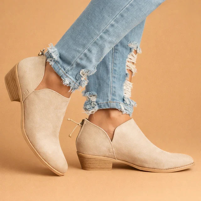 Elegant women's slip-on ankle boots with a comfortable block heel, perfect for chic autumn and winter fashion.