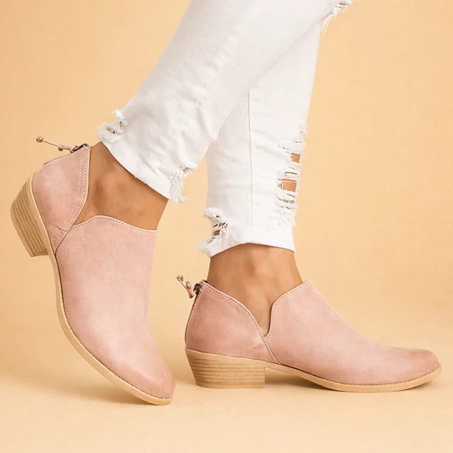 Chic women's slip-on ankle boots with a stylish block heel, offering comfortable and elegant footwear.