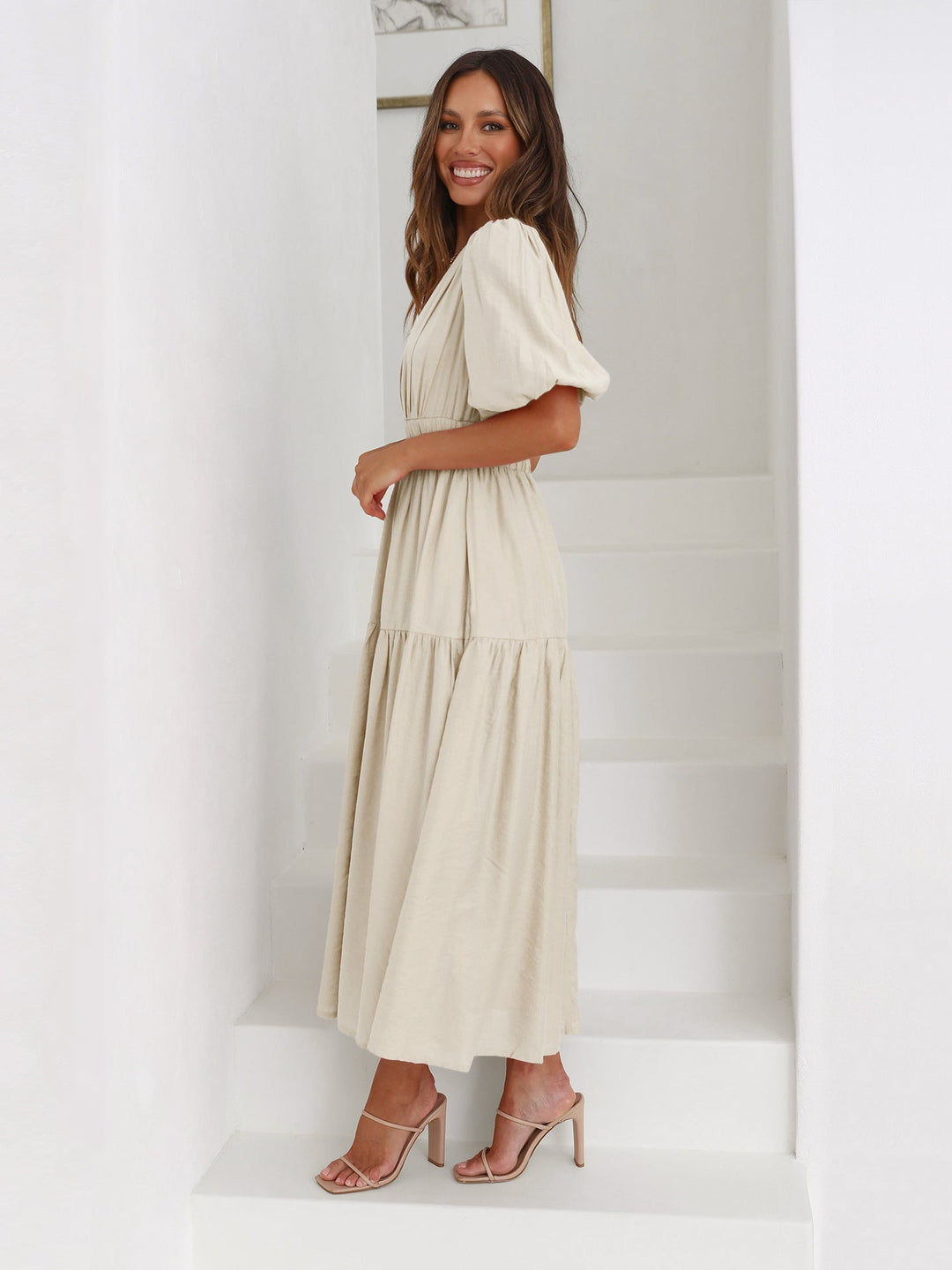Elegant women's pink V-neck smocked midi dress. Ideal for cocktail parties & special events.