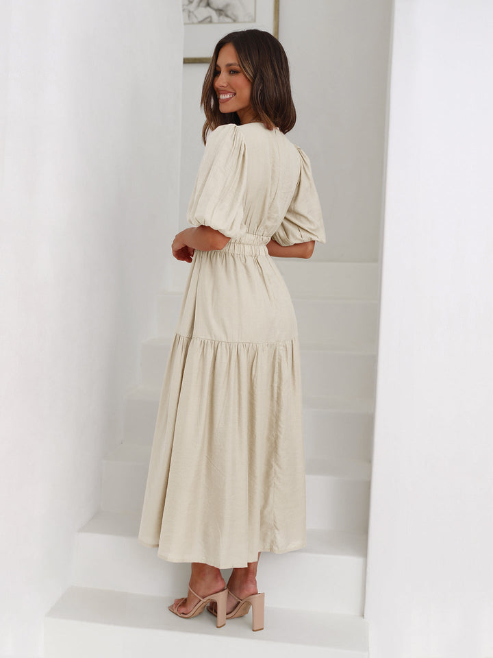 Cream smocked V-neck midi dress for women. Elegant party & evening wear fashion.