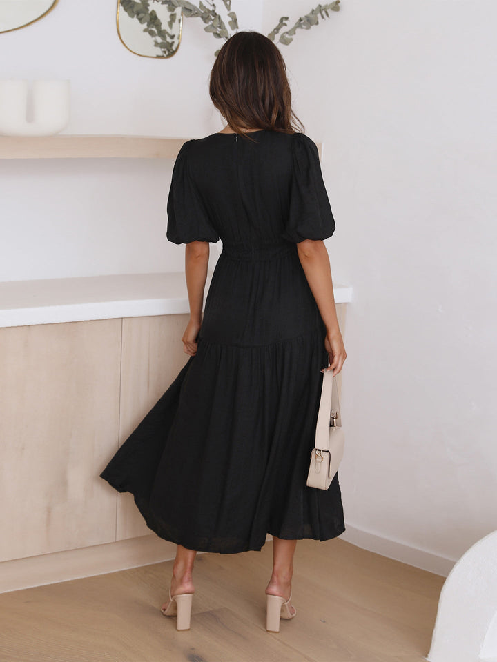 Women's V-neck smocked midi dress. Classic style for cocktail parties & evening events.