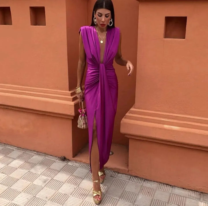 Close-up of elegant women's pleated midi dress details, showcasing soft fabric and a sophisticated look for special events.