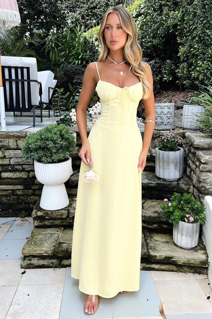 Elegant women's spaghetti strap maxi dress with a stylish tie-front bust, perfect for summer parties.