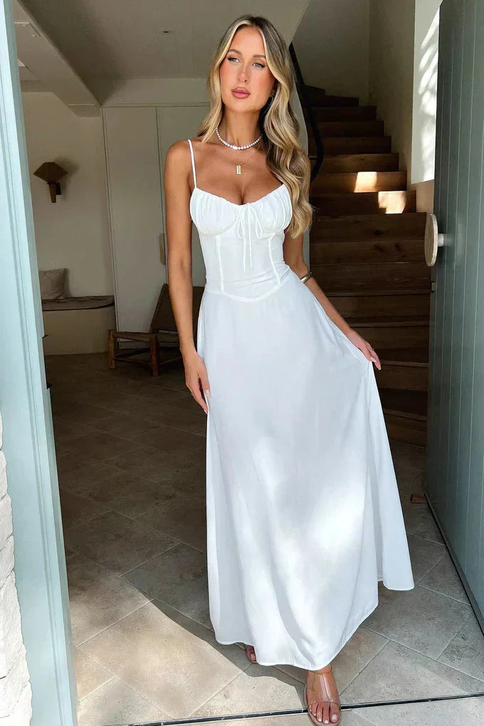 Formal women's spaghetti strap maxi dress, featuring a flattering tie-front bust, perfect for special occasions.