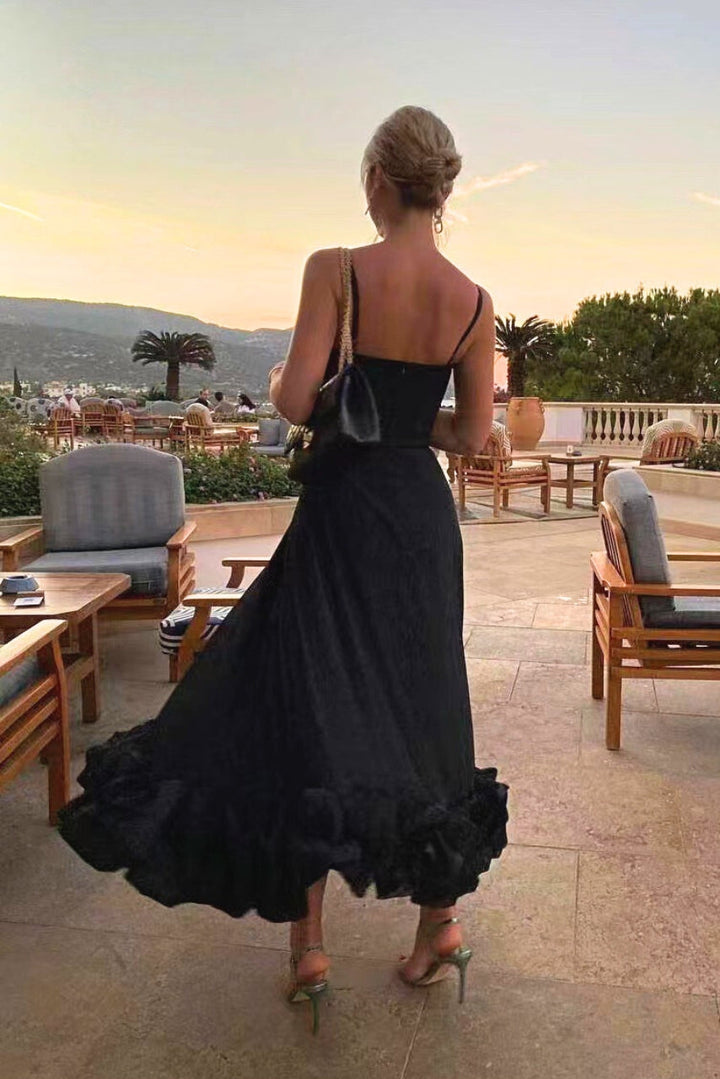 Chic women's high-waist midi dress featuring delicate spaghetti straps and a flowing ruffled hem.
