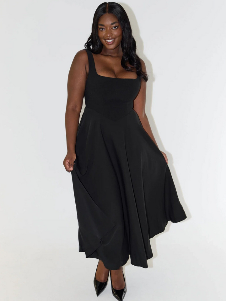 Chic women's sleeveless midi dress with a square neck, A-line cut for summer occasions.