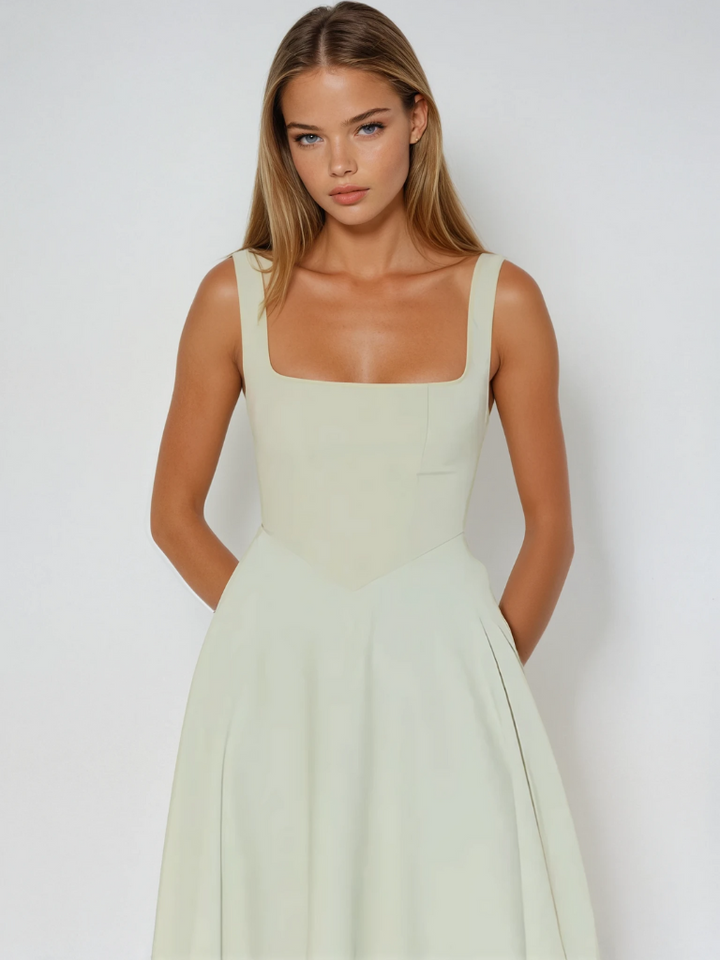Chic sleeveless A-line midi dress with square neck, perfect for summer fashion.