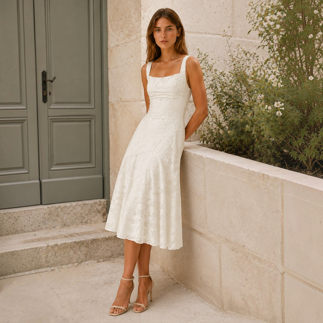 Fashionable women's midi dress with square neck and A-line silhouette, an elegant formal occasion choice.