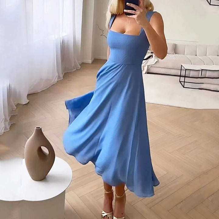 Stylish women's wedding guest midi dress with elegant square neck and puff sleeves for a sophisticated look.