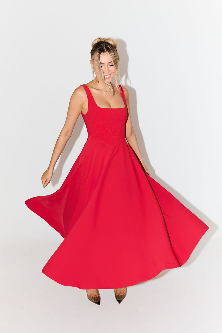 Elegant women's A-line midi dress, sleeveless with a distinctive square neck, summer fashion.