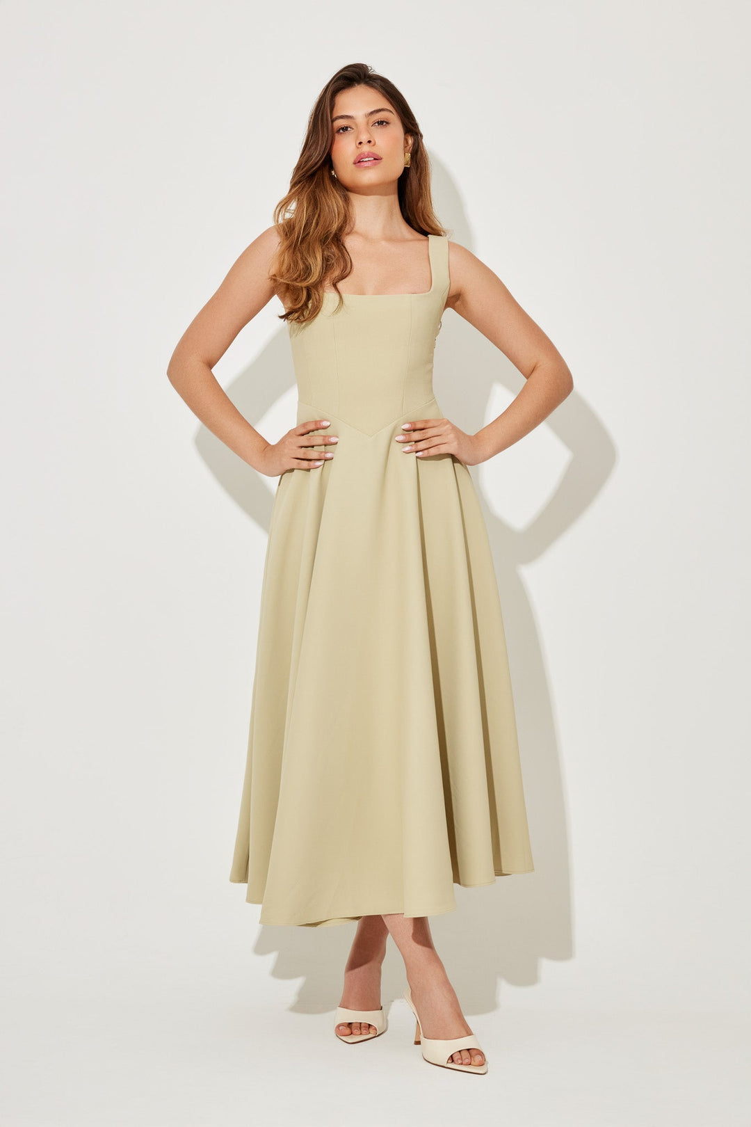 Versatile elegant midi dress for women, sleeveless with a modern square neckline.