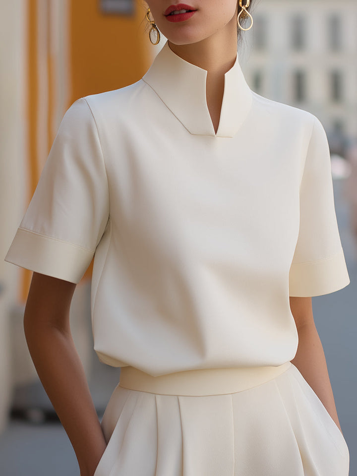 Elegant women's stand-collar short sleeve blouse, perfect for chic office wear or a feminine casual top.
