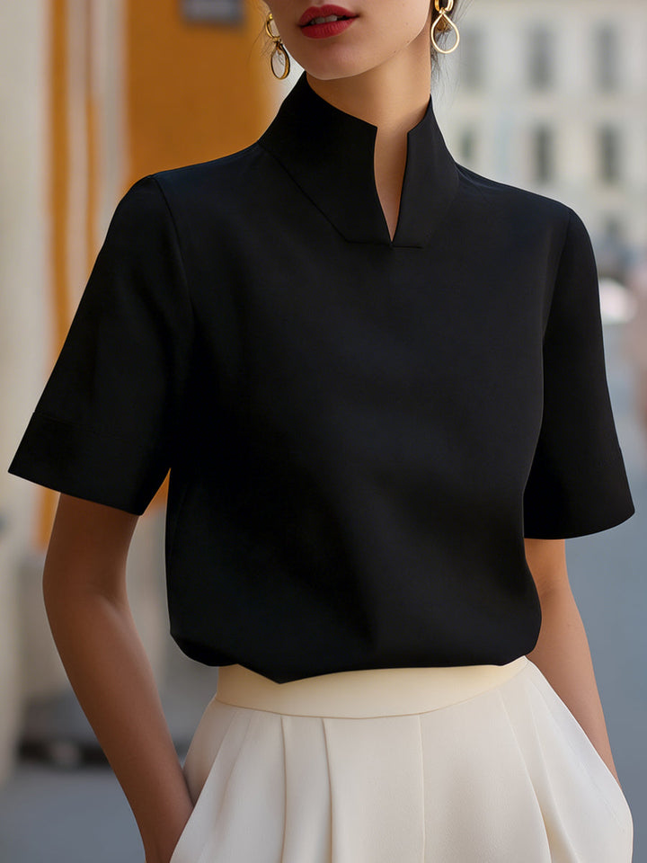 Chic women's short sleeve blouse with a stylish stand collar. Versatile for office, summer, or everyday wear.