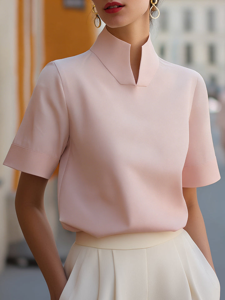 Elegant women's stand-collar blouse with short sleeves. A versatile top, ideal for office, casual, or summer wear.