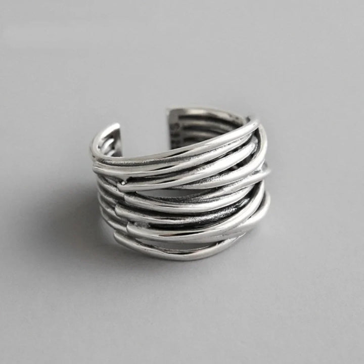 Elegant women's sterling silver adjustable layered open-cuff ring. A fashionable and versatile silver jewelry piece.