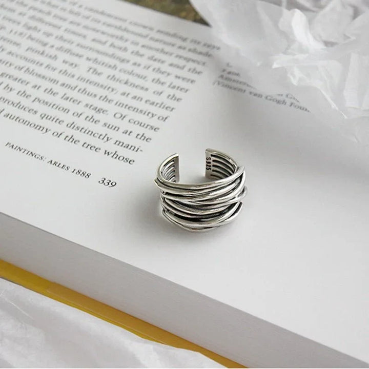 Stylish women's sterling silver adjustable layered open-cuff ring. Modern silver jewelry, an elegant statement piece.