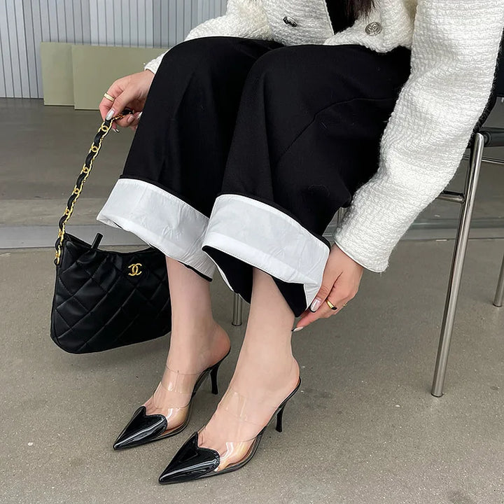 Formal women's stiletto mules, elegant slip-on heels with unique heart toe detail for special occasions.