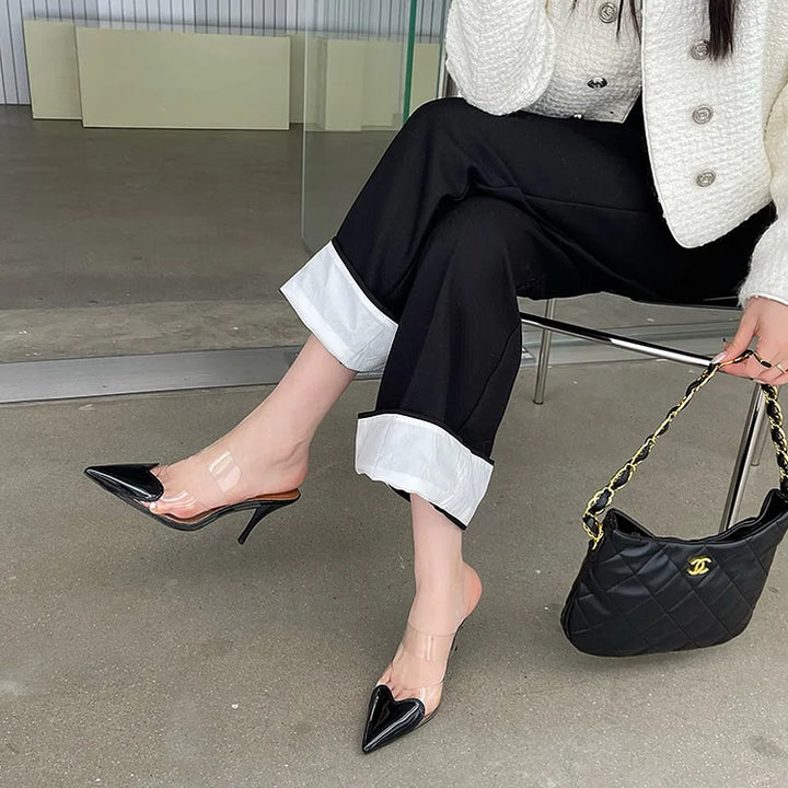 Women's elegant stiletto mules, slip-on party heels with unique heart toe detail for formal wear.