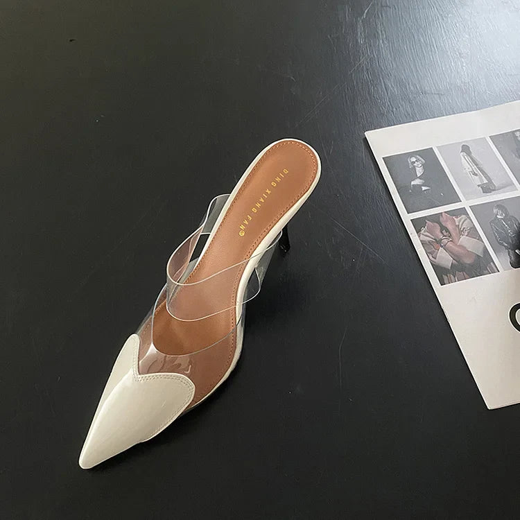 Chic women's stiletto mules, formal evening shoes featuring a playful heart-shaped pointed toe design.