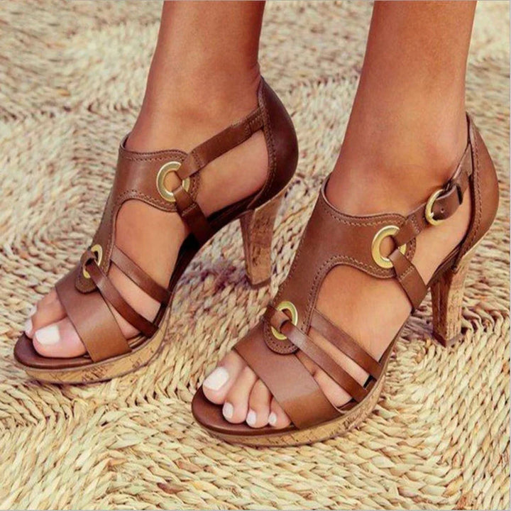 Stylish women's strap heels offering confident style. Versatile formal footwear for evening occasions.