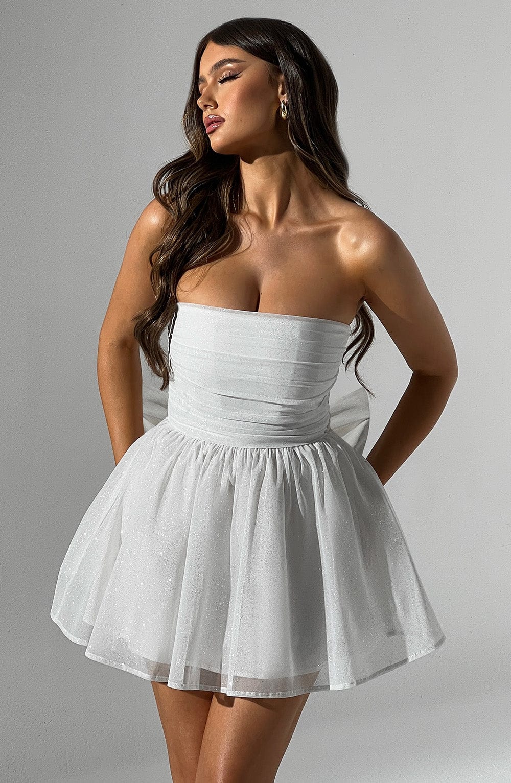 Versatile white strapless A-line mini dress, suitable for celebrations.