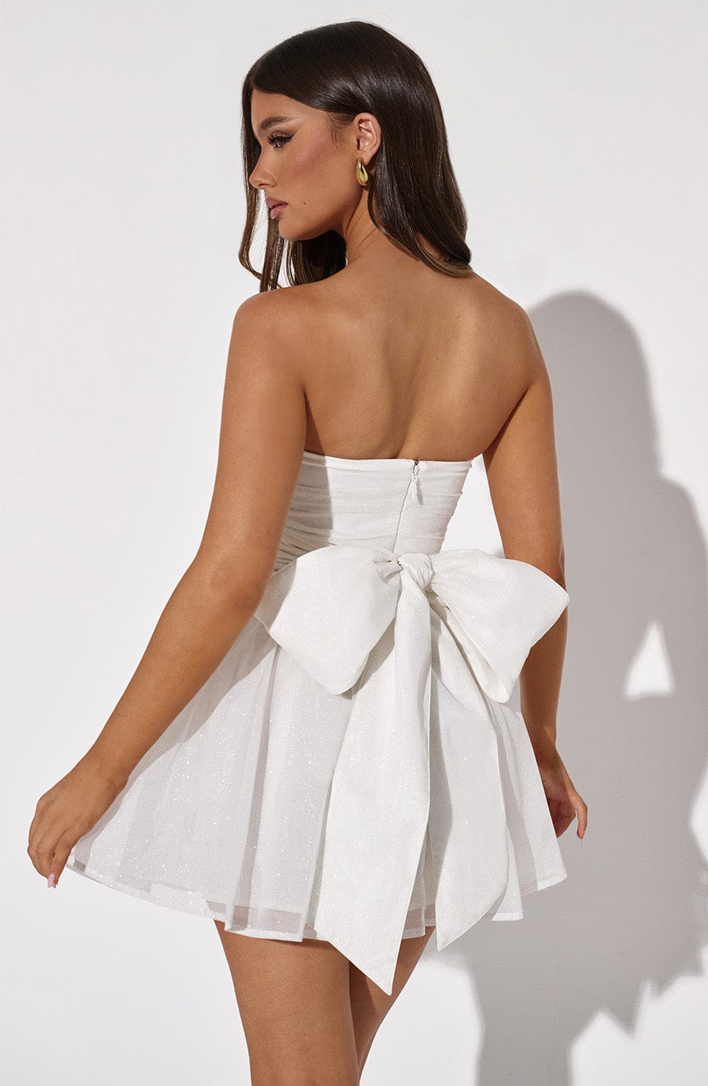 Women's strapless A-line cocktail dress, mini length for a playful look.