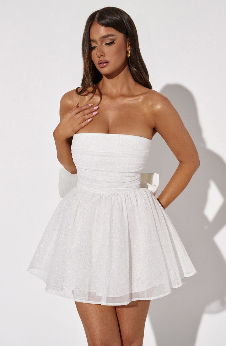 Sleek white strapless A-line mini dress, ideal for evening events.