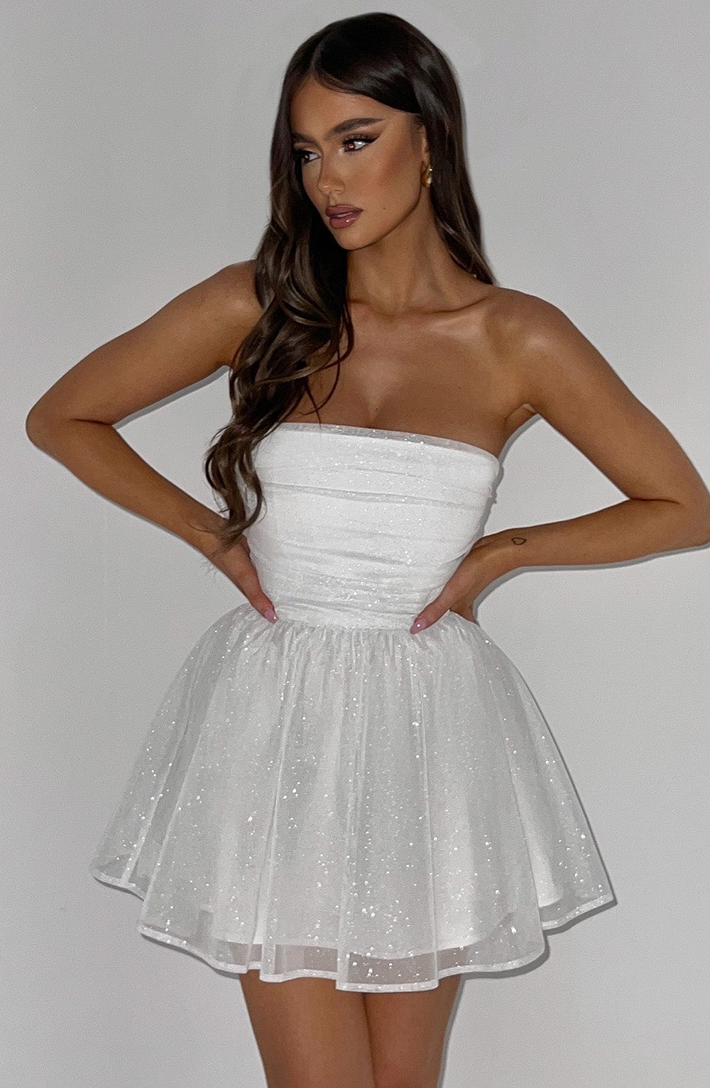 Women's elegant party dress: strapless A-line silhouette, mini length.