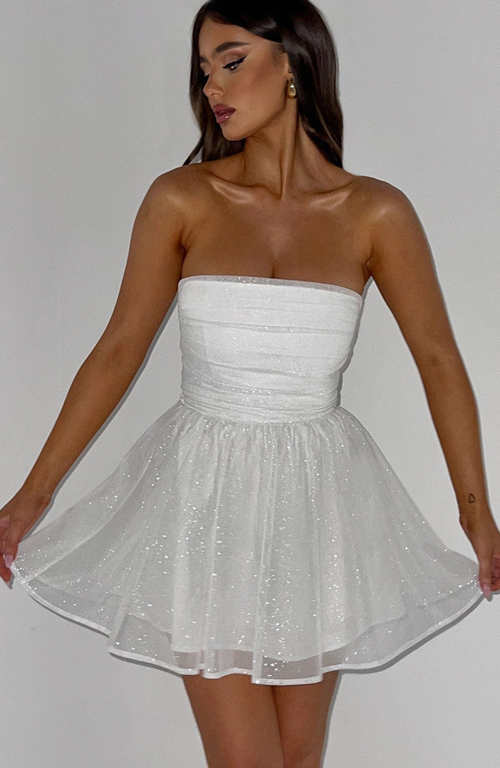 Sophisticated white strapless A-line mini dress for evening celebrations.