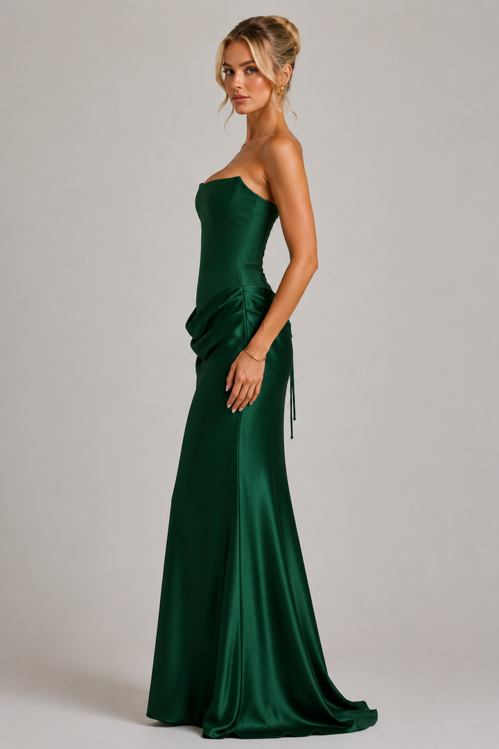 Formal women's long bodycon dress, featuring a strapless corset design. Elegant evening wear for wedding guests.