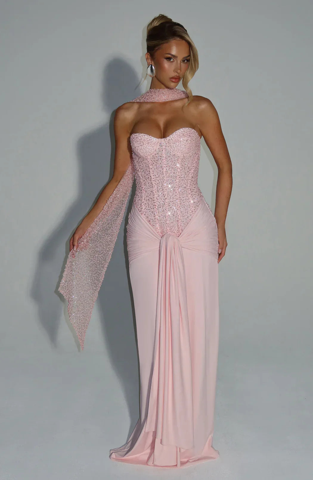 Sophisticated pink strapless corset maxi dress for women's evening and wedding guest attire.