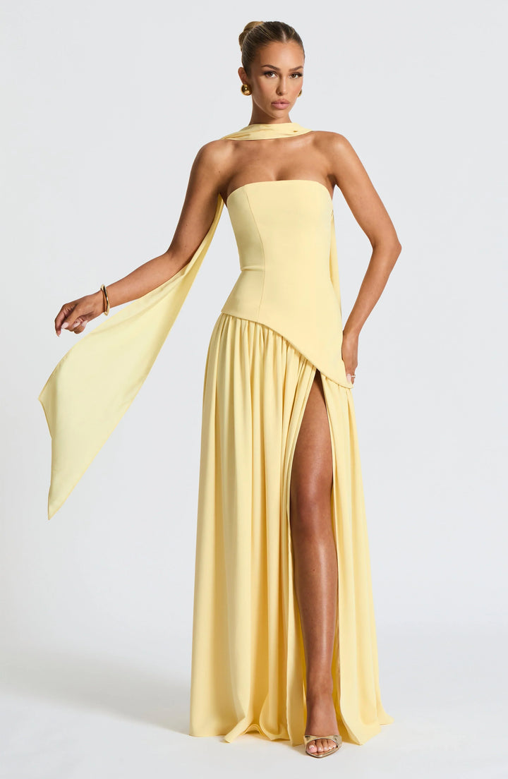 Women's special event dress: strapless, corseted, and a long flowing skirt with an alluring high split.