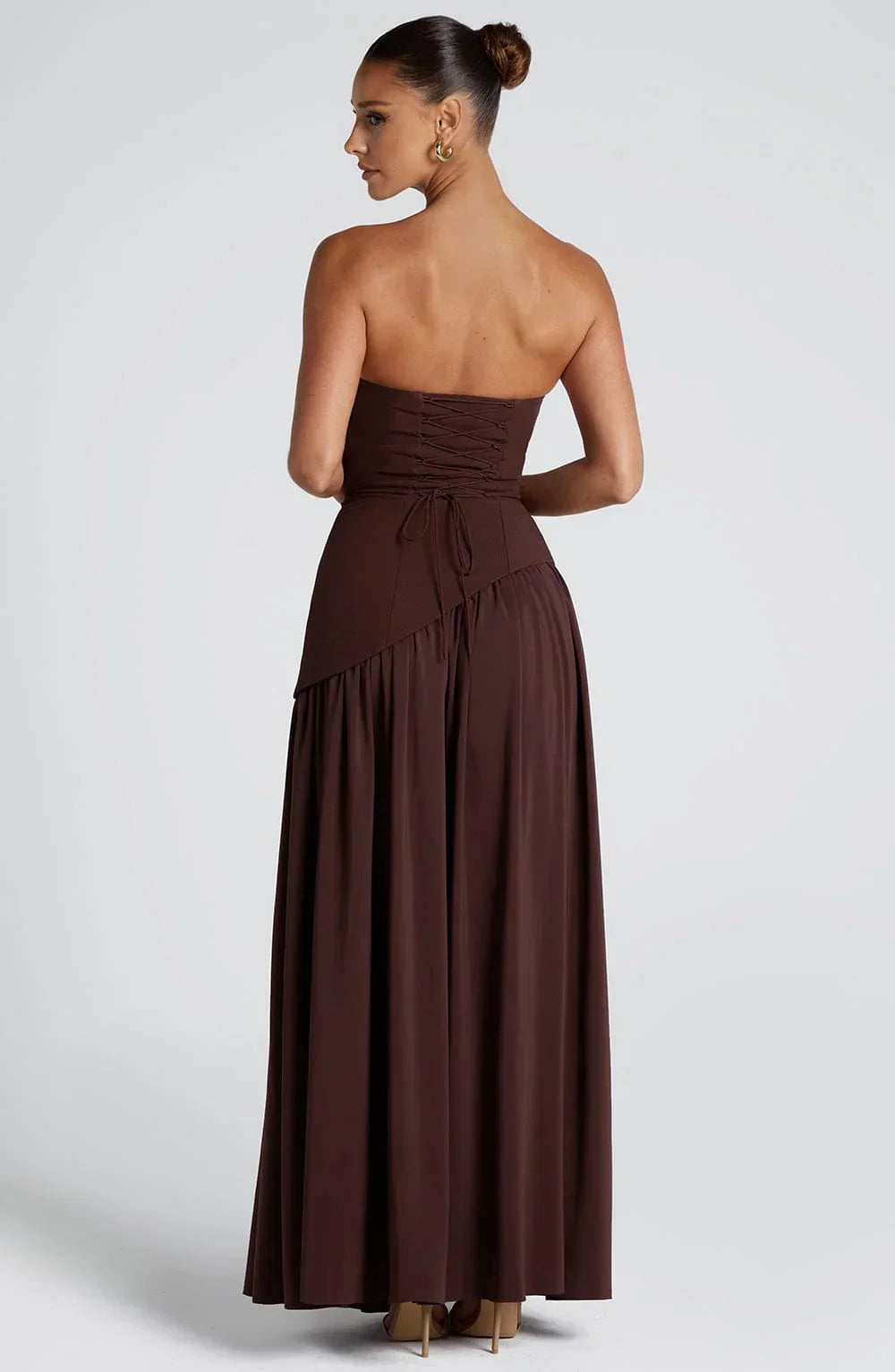 Stunning women's evening gown: strapless, corseted, and a dramatic split. Ideal for elegant parties.