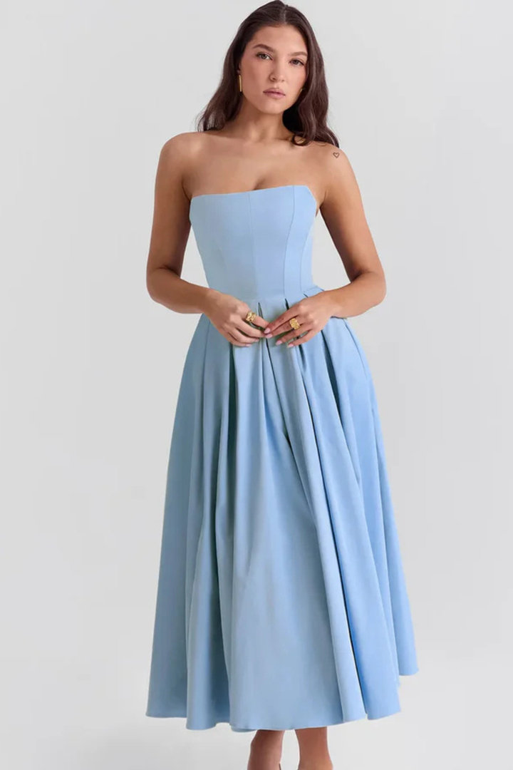 Elegant strapless midi dress with corset top & flowing flared skirt, suitable for formal wear & occasion events.