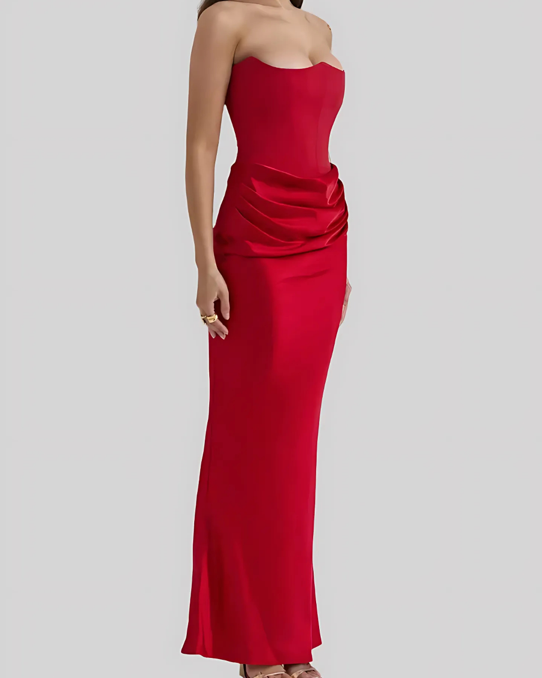 Women's formal strapless maxi dress with elegant draping, suitable for wedding guests & special occasions.