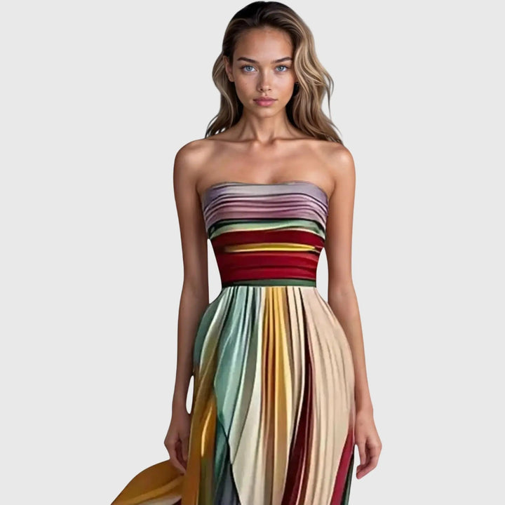 Handcrafted women's strapless flowing maxi dress with colorful rainbow stripes, ideal for stylish summer fashion.