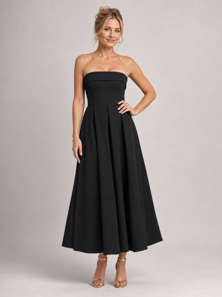 Elegant women's strapless midi dress for formal events. Structured A-line silhouette, perfect cocktail attire.