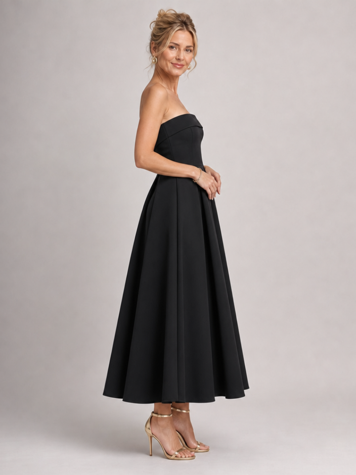 Sophisticated women's structured midi dress, strapless design for elegant parties and occasions.