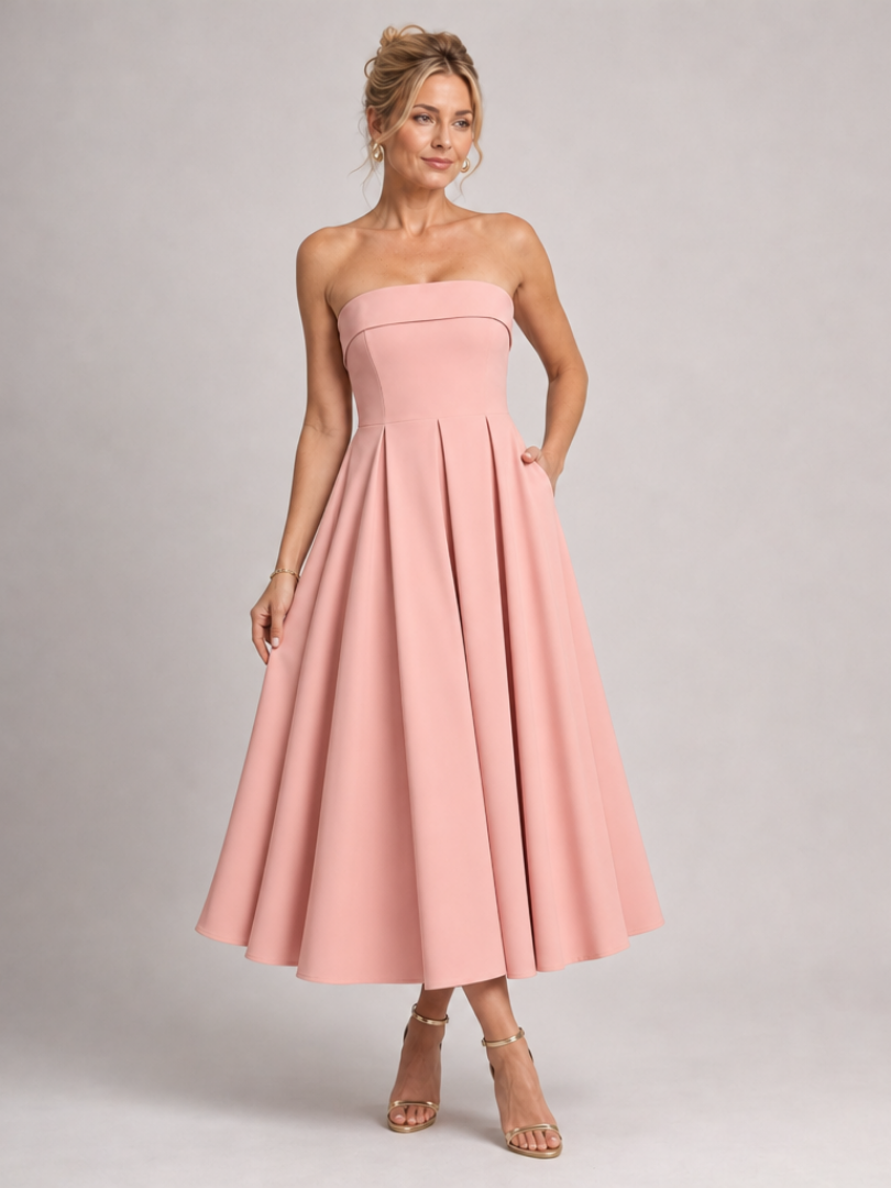 Women's elegant strapless midi dress, structured for a flattering A-line silhouette. Ideal formal party wear.