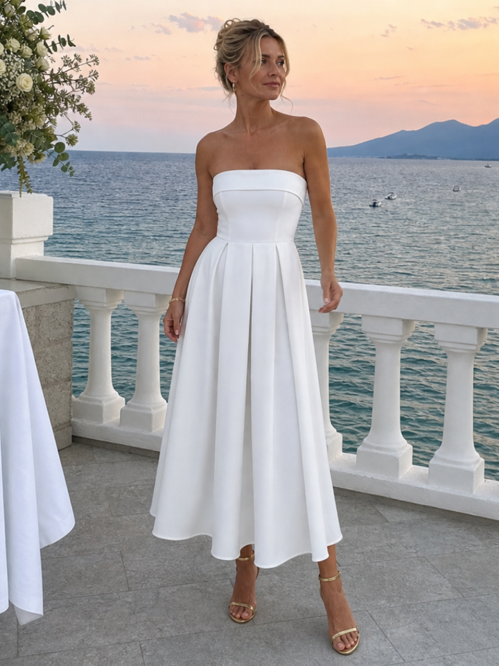 Classic women's elegant strapless structured midi dress. Ideal formal occasion or cocktail party attire.